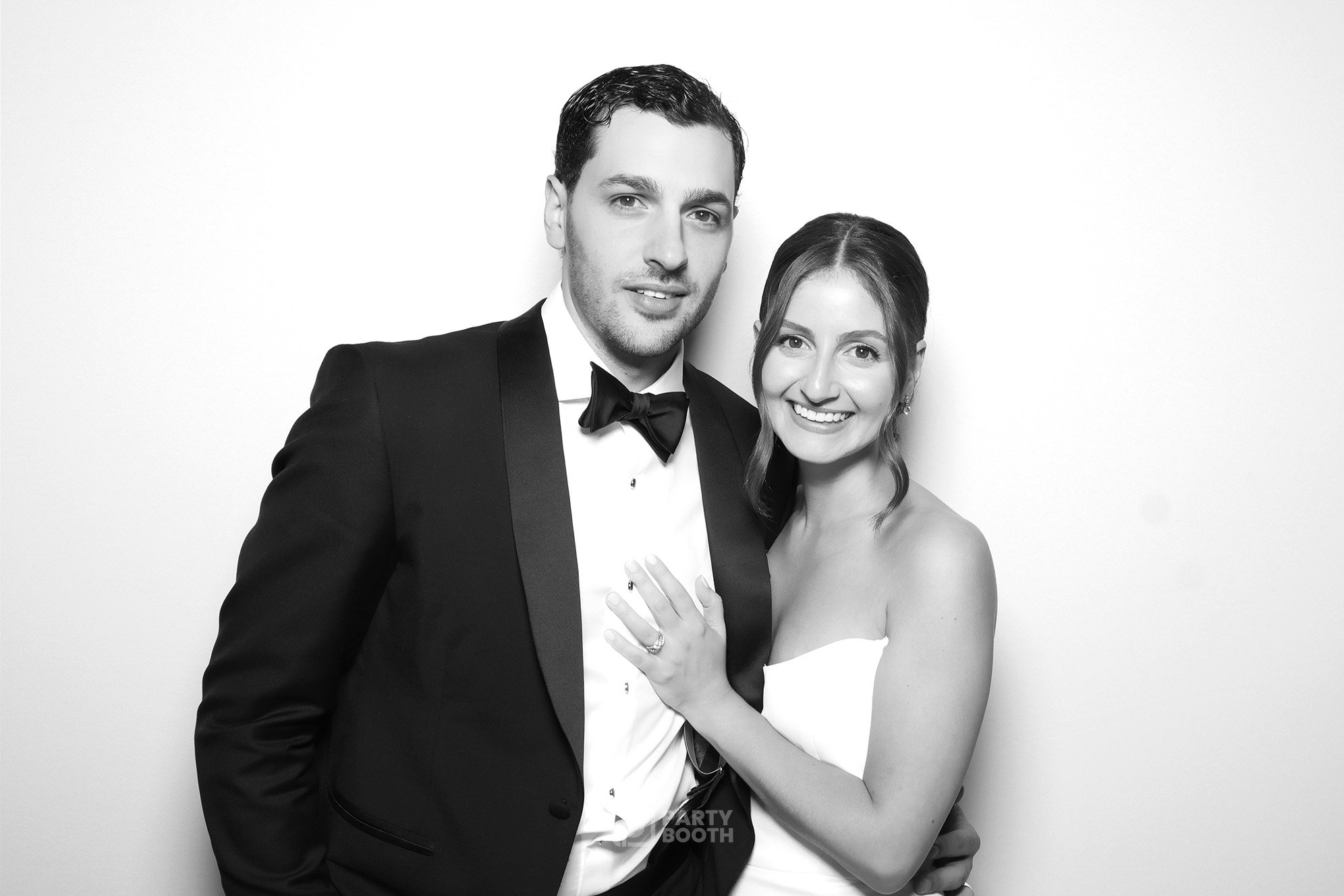 bride and groom at black and white photo booth